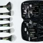 Open makeup brush set bag showing interior organization by MB Cosmetics BZ