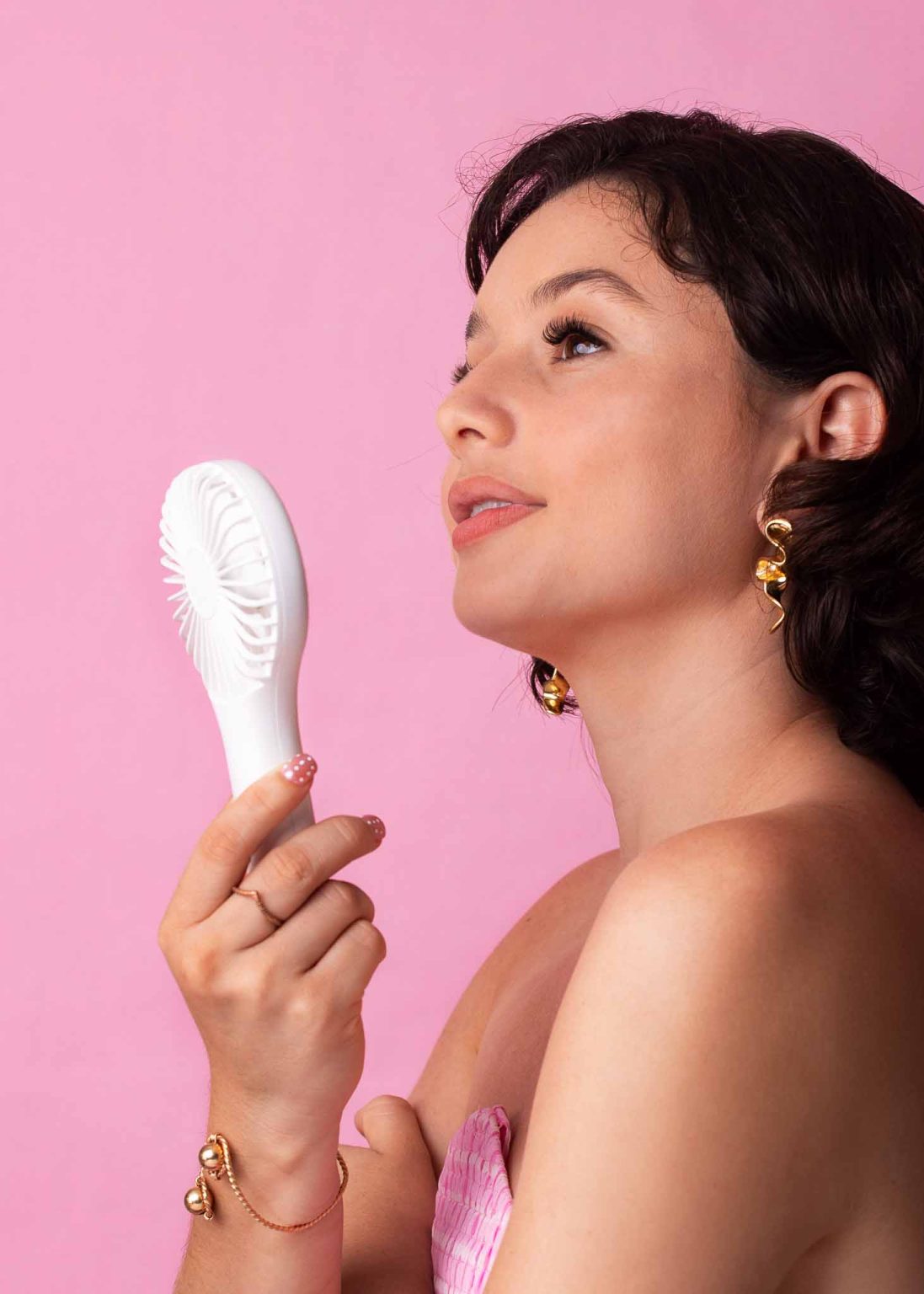 Model showing off her MB Cosmetics Mini Fan from the side view
